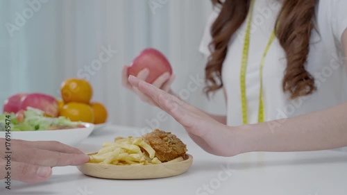 slim body Women choose during salad and fried chicken, female choose salad for diet. Good healthy food. weight lose, balance, control, reduce fat, low calories, routines, exercise.