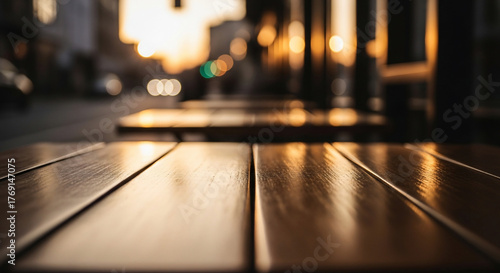 Wooden Cafe Table Close-Up with Golden Hour Light and Blurred Urban Street Background