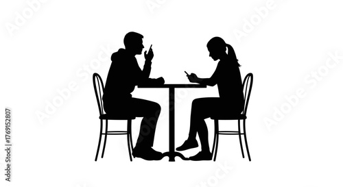 A silhouette of a couple at a table one gesturing while speaking