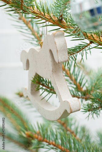 rocking horse decoration hanging on Christmas tree