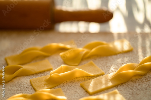 Quadro su tela Making crispbread cookies for Fat Thursday, they are lying on a board, in the ba