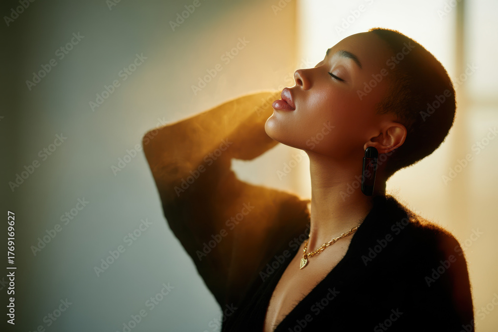 Naklejka premium Young woman enjoying sunlight on her face, feeling peaceful