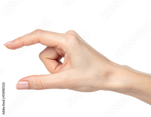 Studio photograph of a woman's hand holding or grasping something small with thumb and index finger, isolated