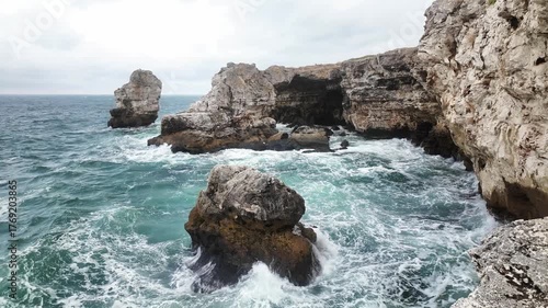 Stormy weather in rock arch in Tyulenovo, Bulgaria. Tulenovo stone arc. Dramatic landscape symbolizing nature's power and wild beauty.