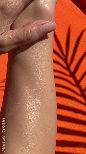 woman applying sunscreen