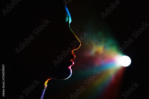 Colorful silhouette of woman in neon light projecting virtual reality