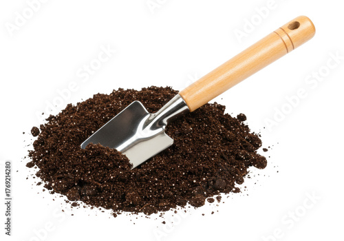 Isolated pile of potting soil with a trowel for gardening work and preparing the land