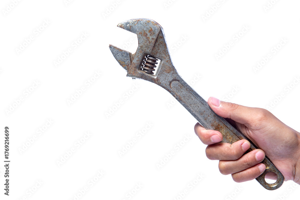 Obraz premium hand holding a wrench on a white background with negative space