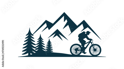 Mountain biker silhouette riding through pine trees amidst majestic peaks
