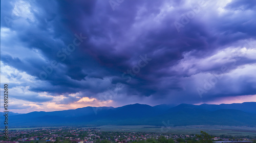 midgard. Dark purple storm clouds gathering before rainfall, dramatic sky formation, natural weather phenomenon. travel magazines, destination branding, designed for travel destination branding.