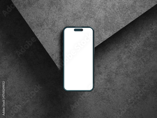 Blank phone screen on gray cement texture with shadows and depth.