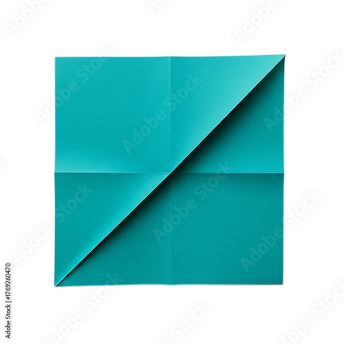 A square of cyan-colored paper is folded, with a diagonal crease bisecting the design. The dark background enhances the vibrant hue