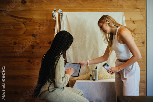 Two women collaborating on content creation in a creative workspace