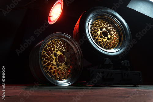 old retro stylish wheels collapsible two-component with a gold center and shiny rims for car tuning long exposure photo to simulate movement