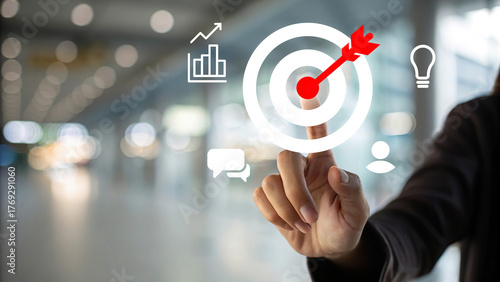 Businessman touching digital target icon with arrow hit bullseye, marketing strategy, KPI performance analytics, customer engagement and business success 