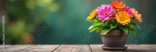 Wallpaper Mural A vibrant, healthy potted plant bursting with colorful flowers, sitting on a rustic wooden table against a blurred background Perfect for spring, home decor, and gardening themes , garden, green Torontodigital.ca