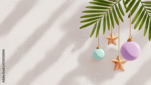 Tropical Christmas scene with a palm leaf, golden stars, and pastel-colored ornaments hanging against a white wall with shadows.