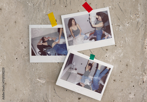 Three wide instant photos are taped to a textured surface