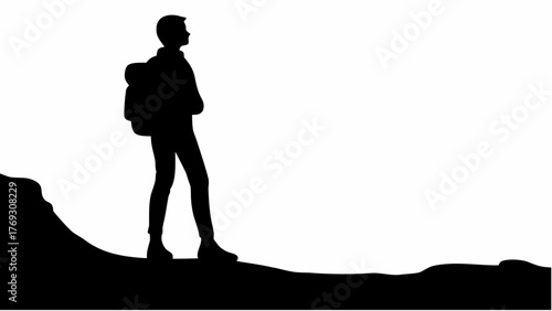 Silhouette of lone hiker with backpack standing atop mountain, adventure and exploration concept