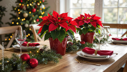 Christmas table setting with poinsettias and festive decorations