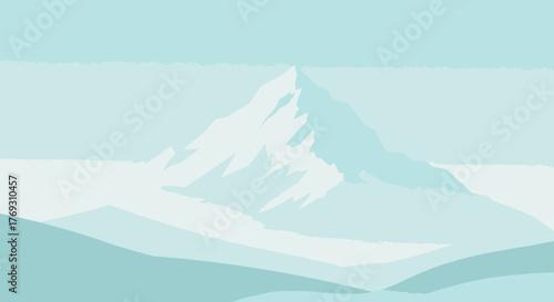 Majestic Snow-Capped Mountain Peak Against a Soft Blue Sky