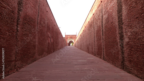 The long walkway with brick walls in Agra Fort (Qila Agra), Agra, Uttar Pradesh, India | UNESCO World Heritage Site	