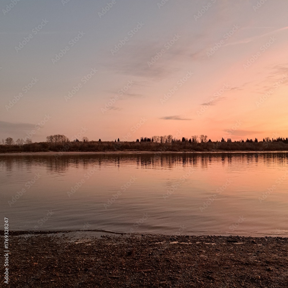 Naklejka premium sunset over the river