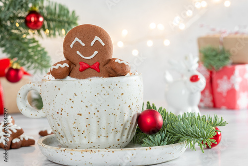 Wallpaper Mural A gingerbread man is sitting in a cup of hot chocolate Torontodigital.ca