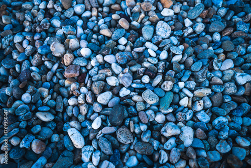 background of blue stones at the beach