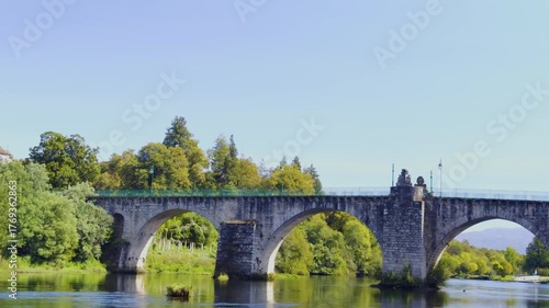 Close up shot of the old roman bridge over the Lima river in Ponte da Barca.