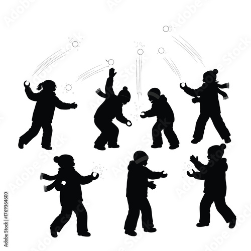 Children silhouettes playing in the snow throwing snowballs