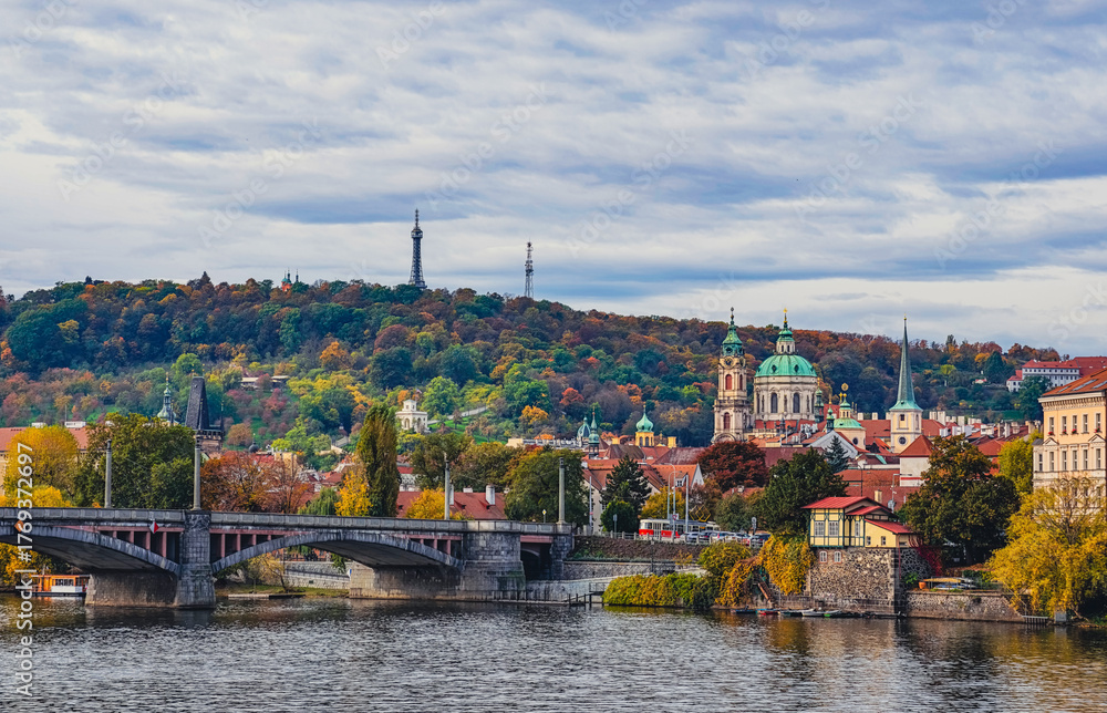 Obraz premium Prague Cityscape Autumn Panorama Vltava River Historic Bridges Church Architecture Fall Foliage Czech Republic European Travel Destination. Ultra HD