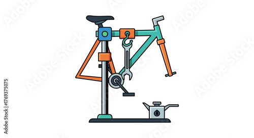 A bicycle frame is suspended on a repair stand with tools nearby.