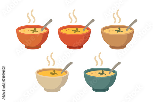 Five steaming bowls of creamy soup garnished with herbs and a spoon set