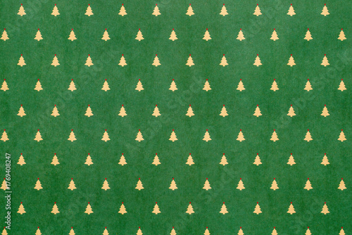 Green Christmas background with snowflakes and christmas trees,seamless pattern of christmas trees and snowflakes on green background,Christmas wrapping paper, Xmas pattern with ornaments.