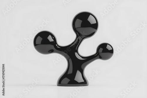 Sleek, black abstract sculpture with rounded forms and a minimalist, modern design.