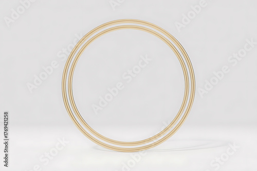Two golden hoops stand against a white background, creating a sense of circular symmetry.