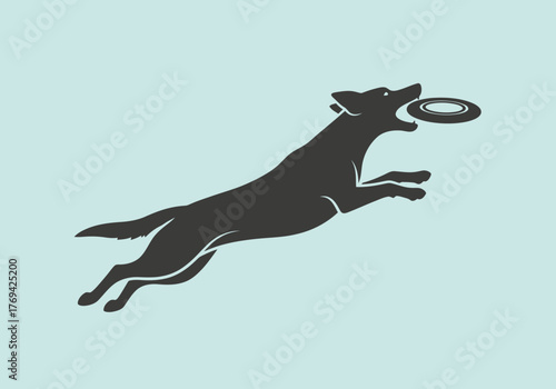Silhouette of a dog leaping to catch a frisbee against a light blue background.
