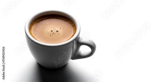 White mug filled with espresso coffee with crema on a white background