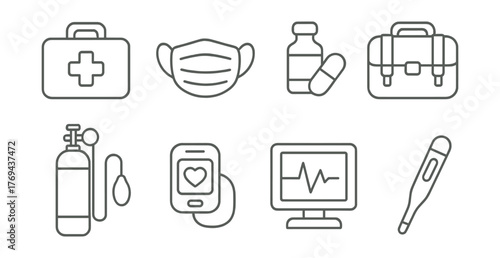 Set of medical supplies and equipment, including a stethoscope, a thermometer