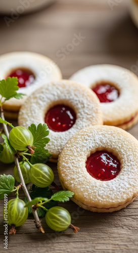 Wallpaper Mural Traditional homemade Linzer cookies with sweet gooseberry jam and powdered sugar, accompanied by a fresh gooseberry branch on a rustic wooden surface. Torontodigital.ca