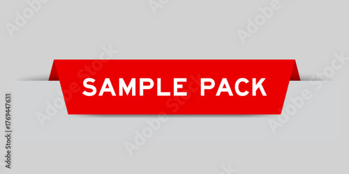Red color inserted label with word sample pack on gray background