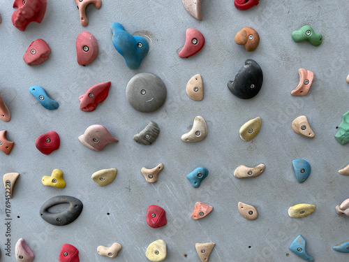 Old climbing wall with closeup climbing hold