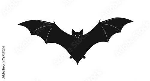 Spooky black bat silhouette with wide-spread wings and detailed features flying against a clear white background, ideal for Halloween themes.