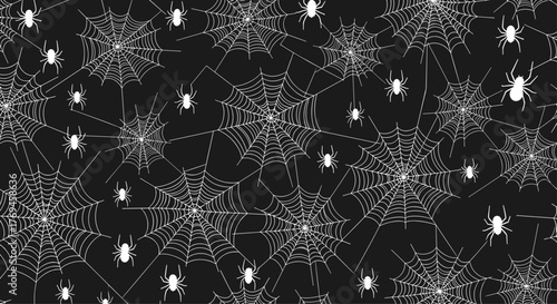 A seamless pattern featuring white spiderwebs and cartoon spiders scattered across a dark black background, ideal for Halloween decorations.