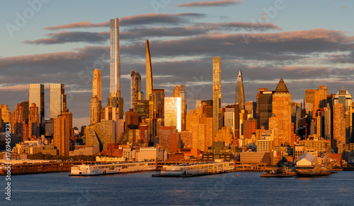 New York City cityscape with skyscrapers and Billionaires Row supertall buildings. Midtown Manhattan buildings and Hudson River at sunset. USA
