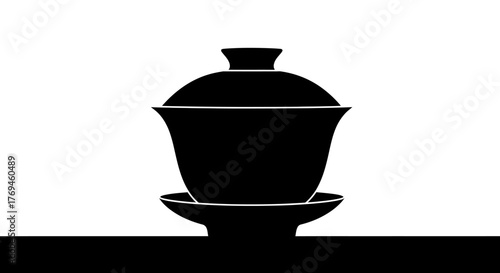 Simple black silhouette of a traditional Chinese gaiwan tea bowl.