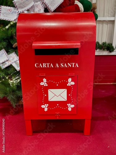 Classic metal letterbox with Spanish writing, representing mail delivery and correspondence.