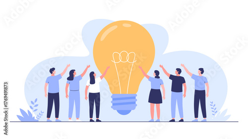 Diverse group of people collaborating and holding up a giant illuminated light bulb symbolizing a shared innovative idea