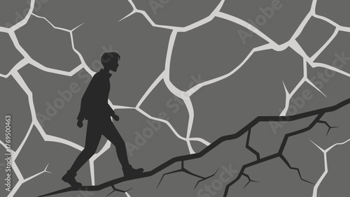 Silhouette of a person walking uphill on cracked dry ground symbolizing struggle and perseverance